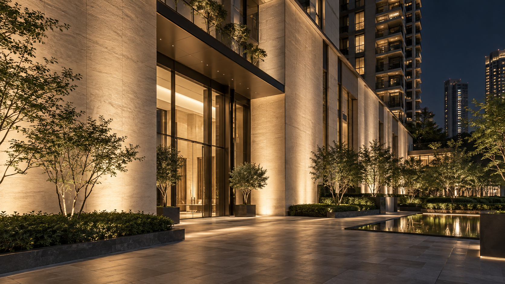 Application illustration — continuous warm-white wall washing across a commercial-residential facade.